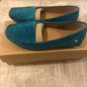 Turquoise suede Ugg’s shoes.